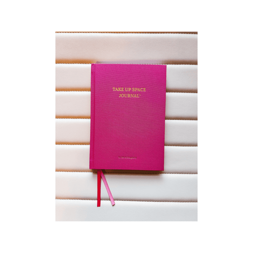 Pink journal titled 'Take Up Space Journal' 