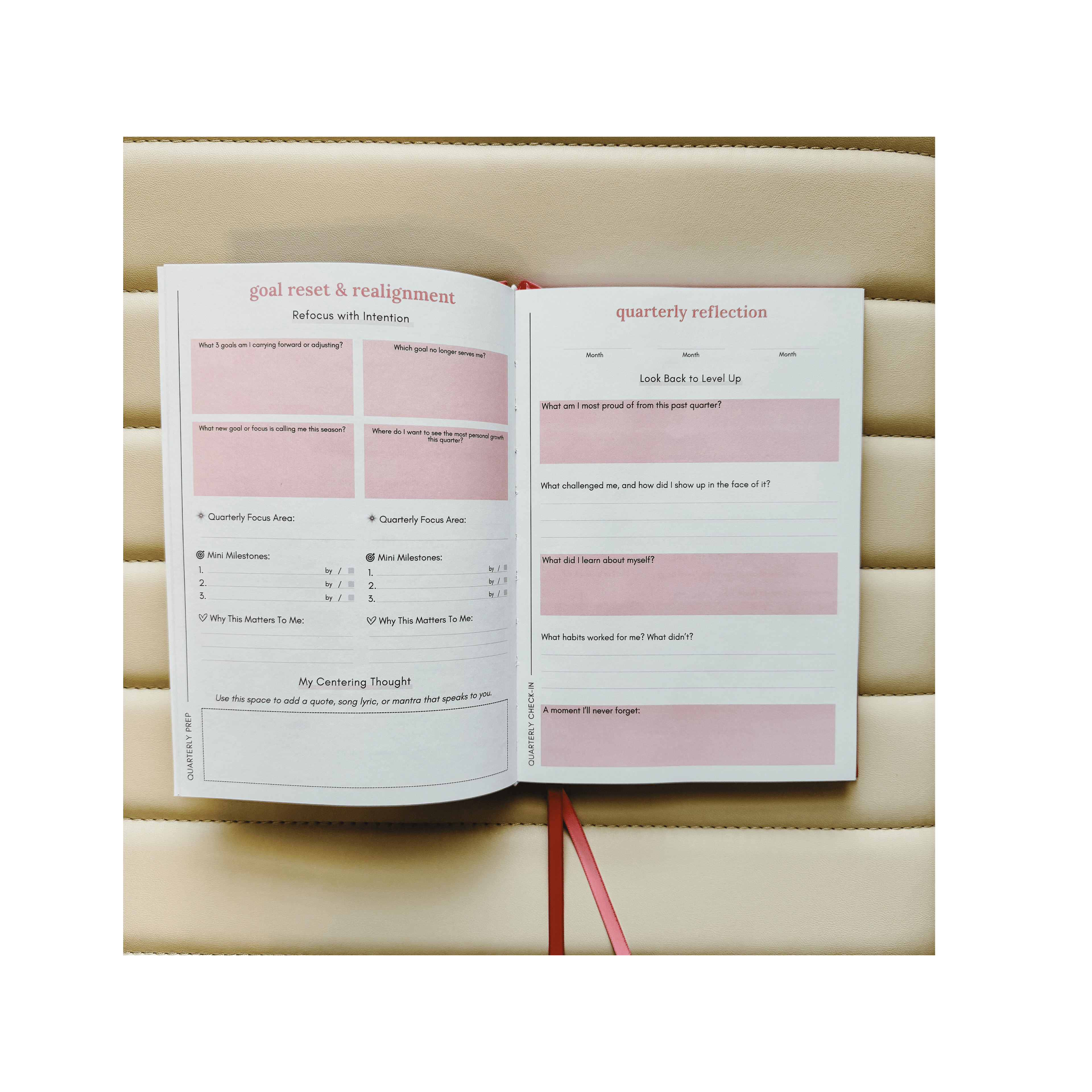 Open book with a pink and white layout on a beige background